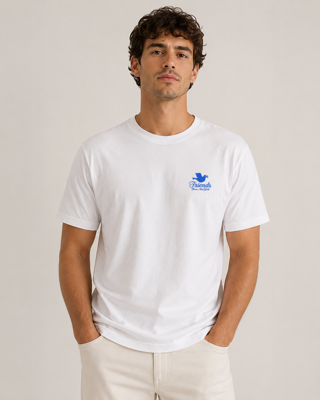 Model wearing a white Friends From New York T-shirt with a small blue dove logo on the left chest.